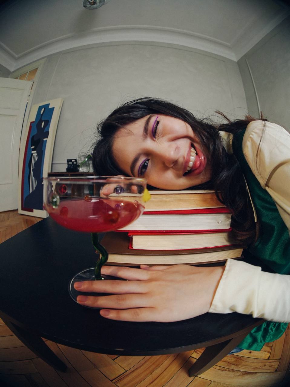 Fisheye editorial shot with a pink drink in a green-stemmed glass for the décor brand